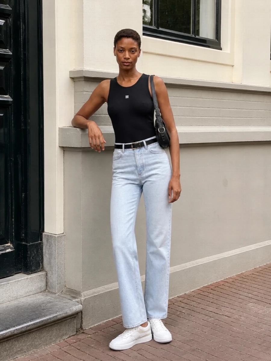 Givenchy black tank ice blue jeans white sneakers