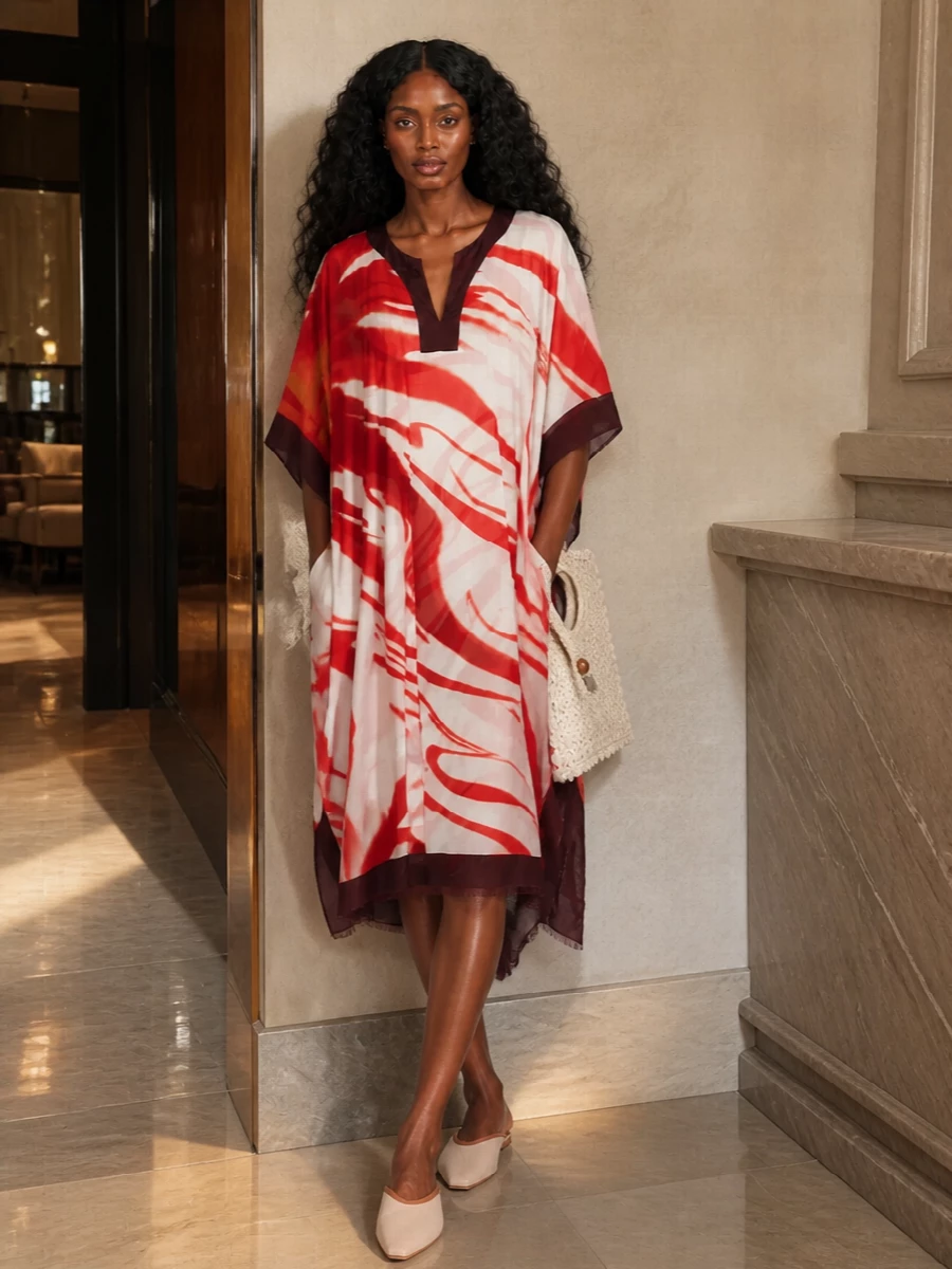 A painterly Dries kaftan stays the clear hero, grounded with blush slingback flats and an airy ivory crochet tote. The terracotta neckerchief quietly echoes the print’s warmth, keeping everything soft, romantic and ready for long summer gatherings. It is relaxed but considered, ideal when you want drama that still feels easy to wear all day.