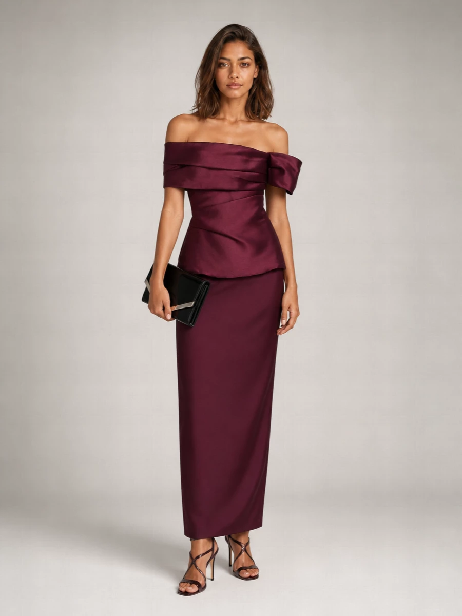 The deep wine Solace London gown and oxblood Jimmy Choo sandals create a rich, monochromatic evening story that feels sculpted rather than showy. I chose the dress path here, because a single, statuesque column amplifies the shoes’ romantic lines far better than separates would. A sharp black patent clutch finishes everything with modern definition and just enough shine for a formal night out.