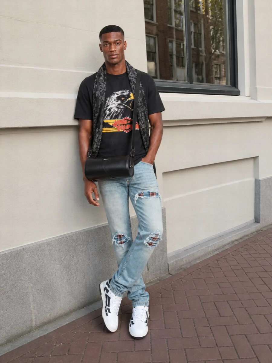 Amiri distressed jeans graphic tee sneakers