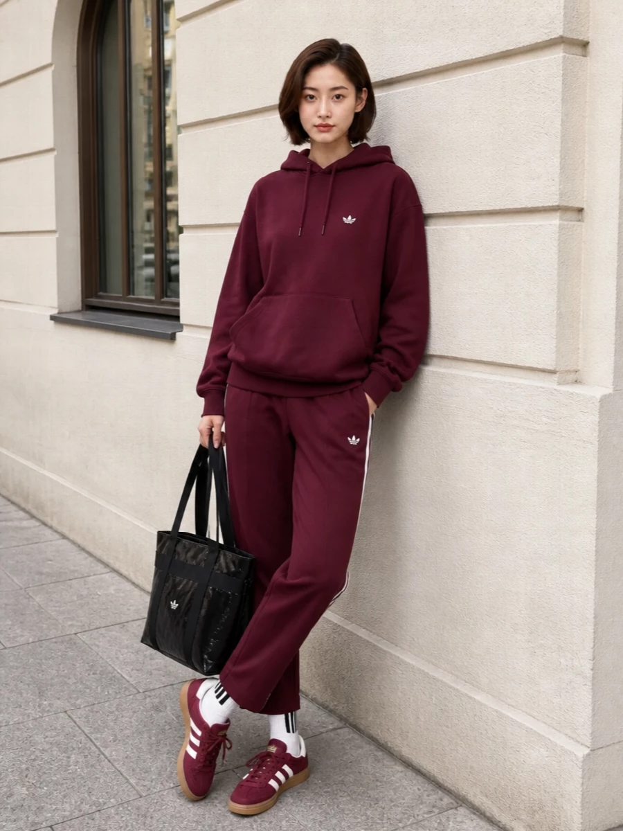 Adidas burgundy hoodie track pants sneakers outfit