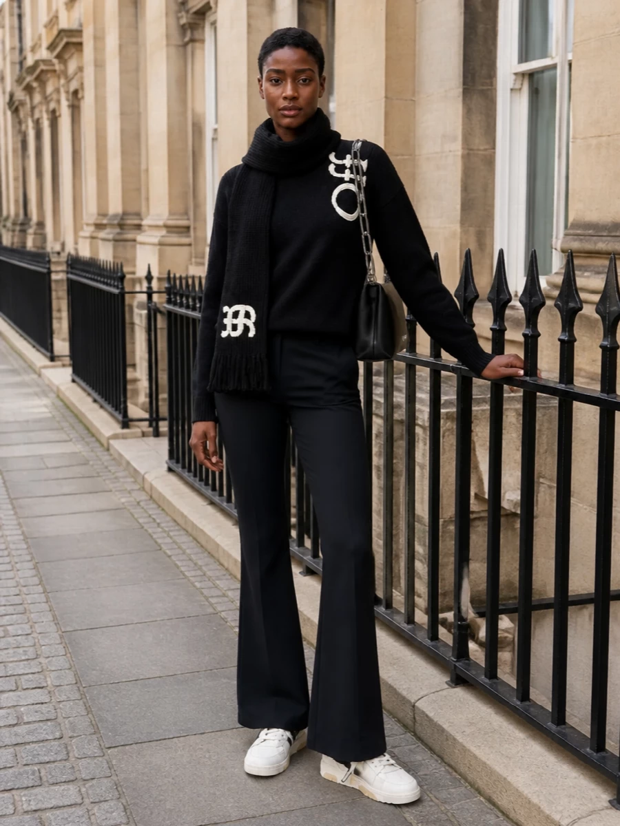 Off white sweater black flared trousers outfit