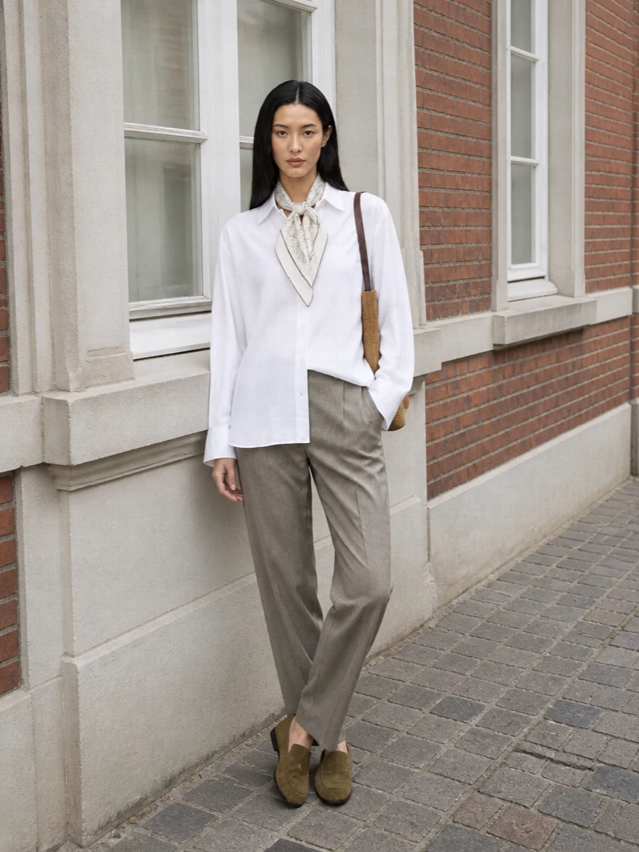 The row white shirt taupe tailored trousers outfit