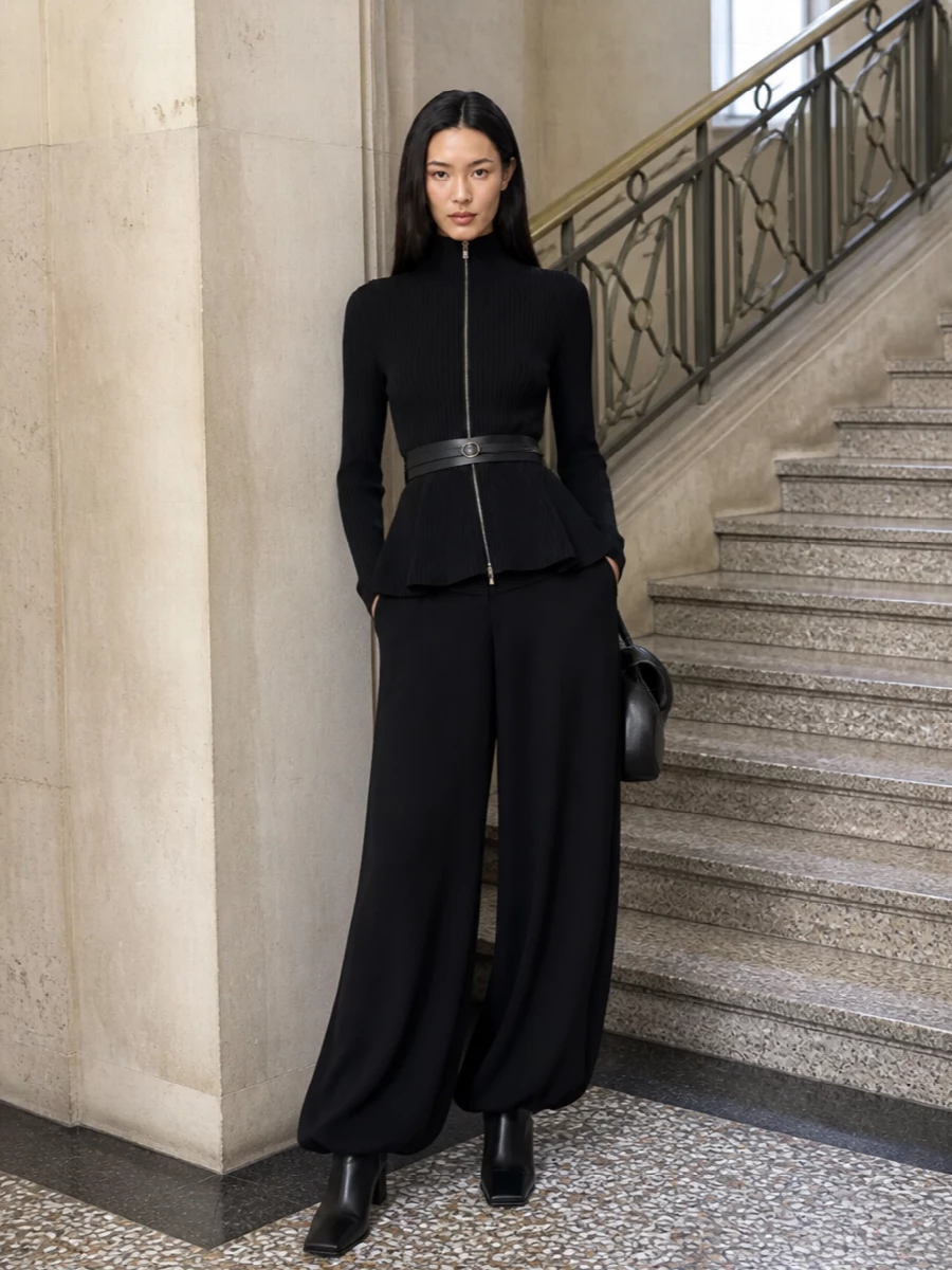 Alaia black peplum top wide leg trousers outfit