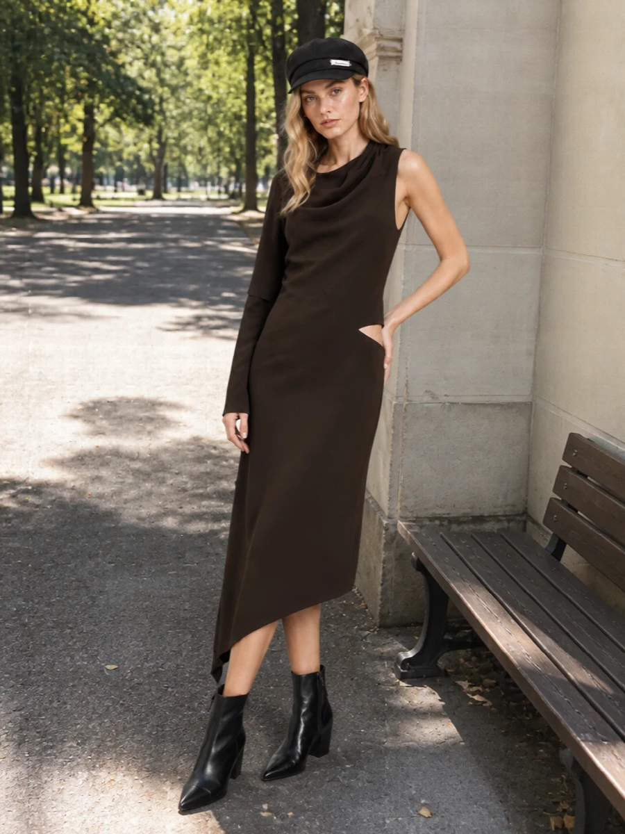 This is a night-ready pairing that keeps the Jacquemus cap’s minimal mood but pushes it into a sharper, almost futuristic register. The Courrèges asymmetric chocolate midi and pointed black ankle boots create a long, sculpted line with subtle y2k attitude rather than pure nostalgia. I chose the dress route over denim and knits to make the cap feel unexpectedly polished after dark instead of purely casual-preppy.