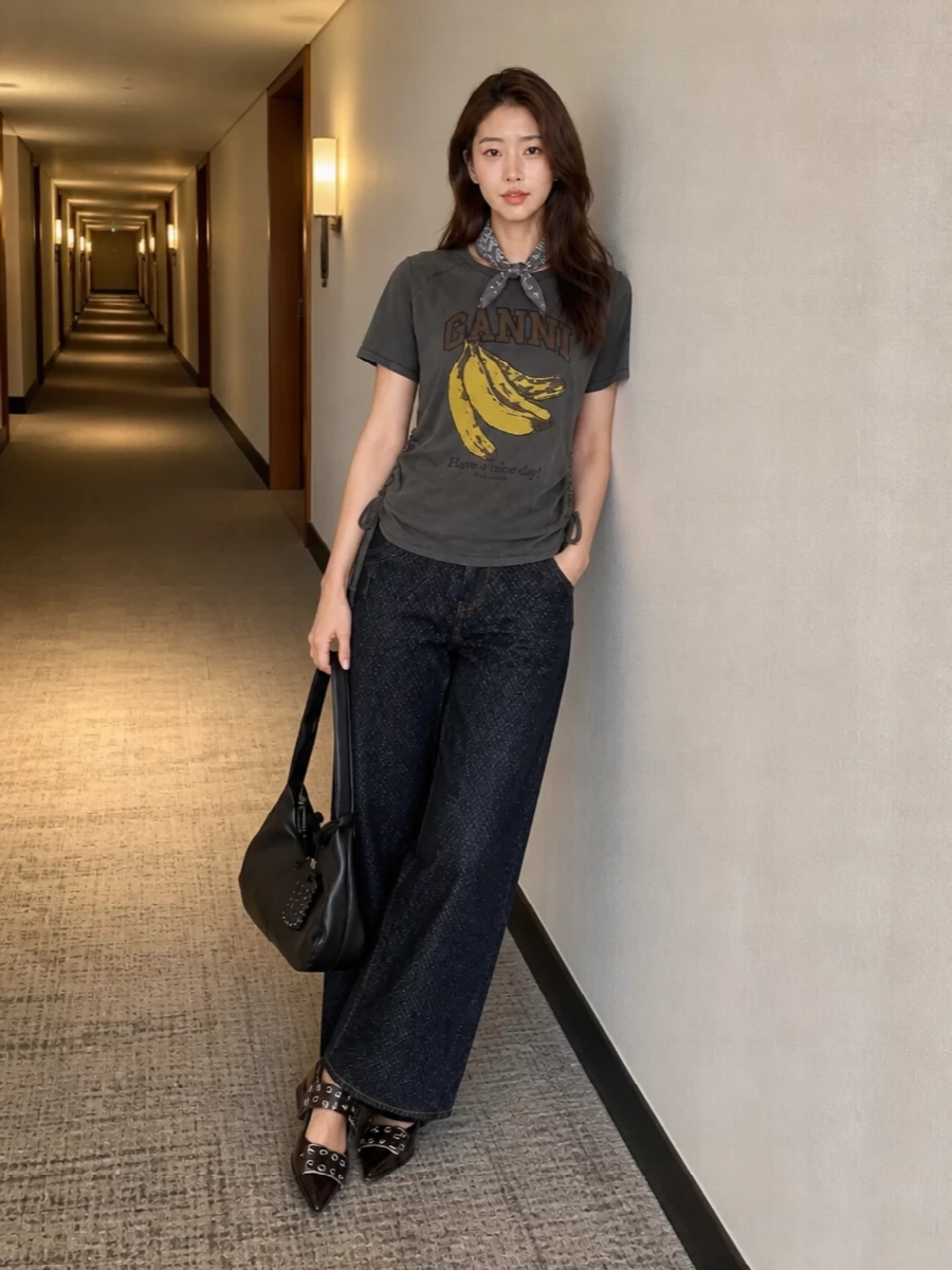 Ganni banana tee wide leg jeans flats outfit