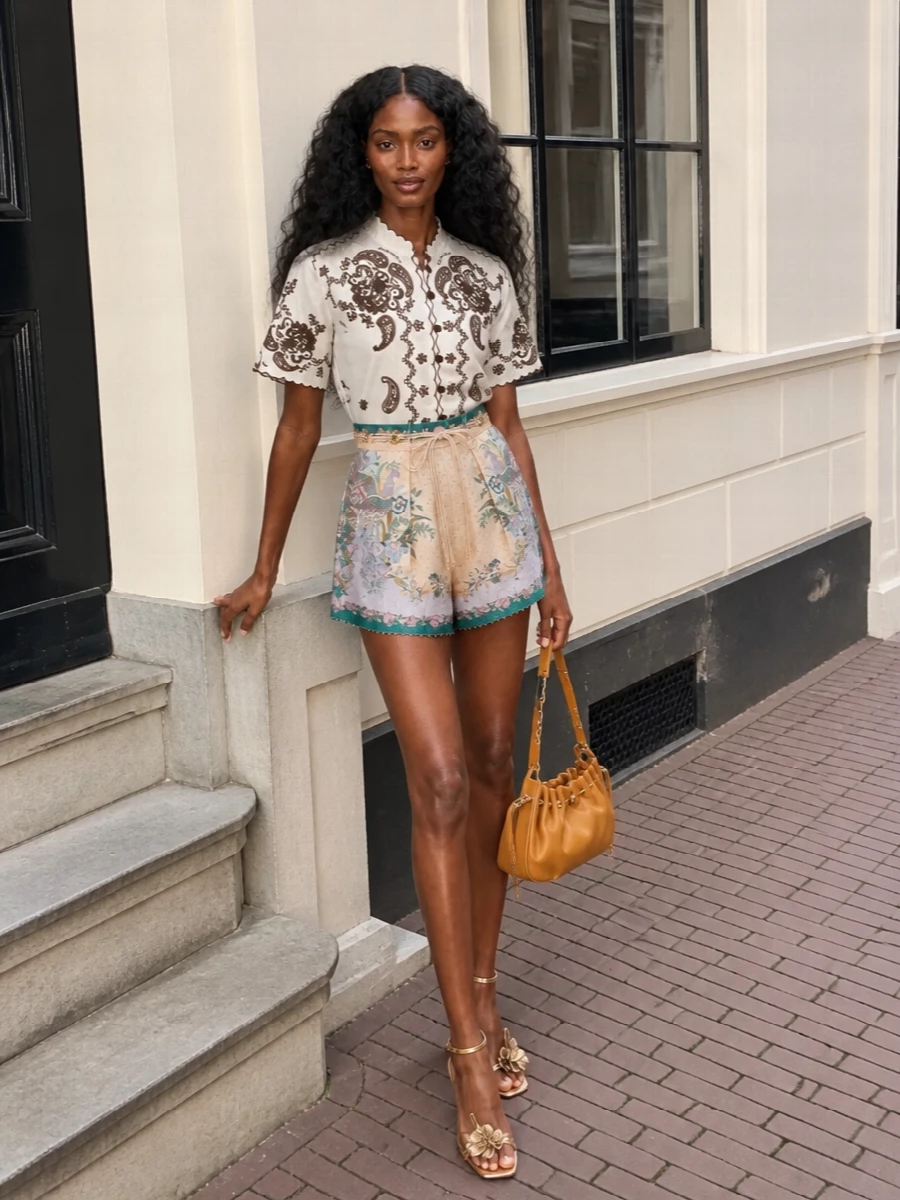 Zimmermann embroidered blouse peacock shorts outfit