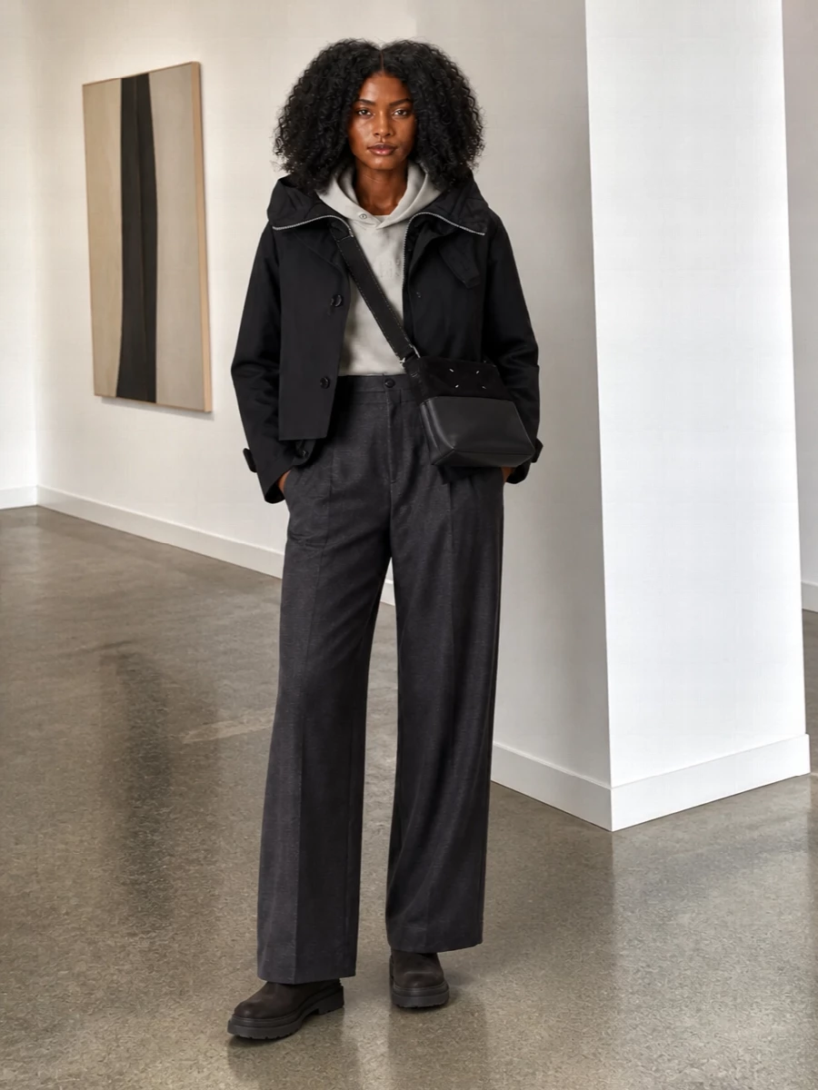 I’m styling the Sacai jacket with separates rather than a dress so its hybrid construction and hood can stay the clear focal point. The Margiela tonal hoodie and Ambush wide-leg trouser create a monochrome, elongated column under the cropped outer shell, while Brunello Cucinelli Chelsea boots and a Margiela cross-body keep the mood quietly technical, city-ready and winter-functional. The result is a coherent, high-tier street-tailored ensemble that feels architectural yet fully practical for long days on the move.