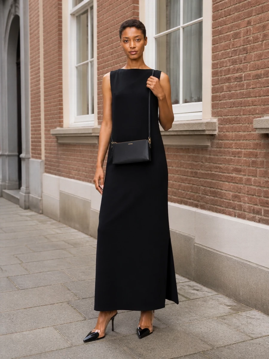 This is a pure black‑tie column built around line, not decoration, letting the Alaïa slingbacks slice through the silhouette. I chose the gown path over separates so the shoes can converse directly with a clean, uninterrupted shape, front and back. The result is a quietly high-impact evening ensemble where every element whispers precision and polish.