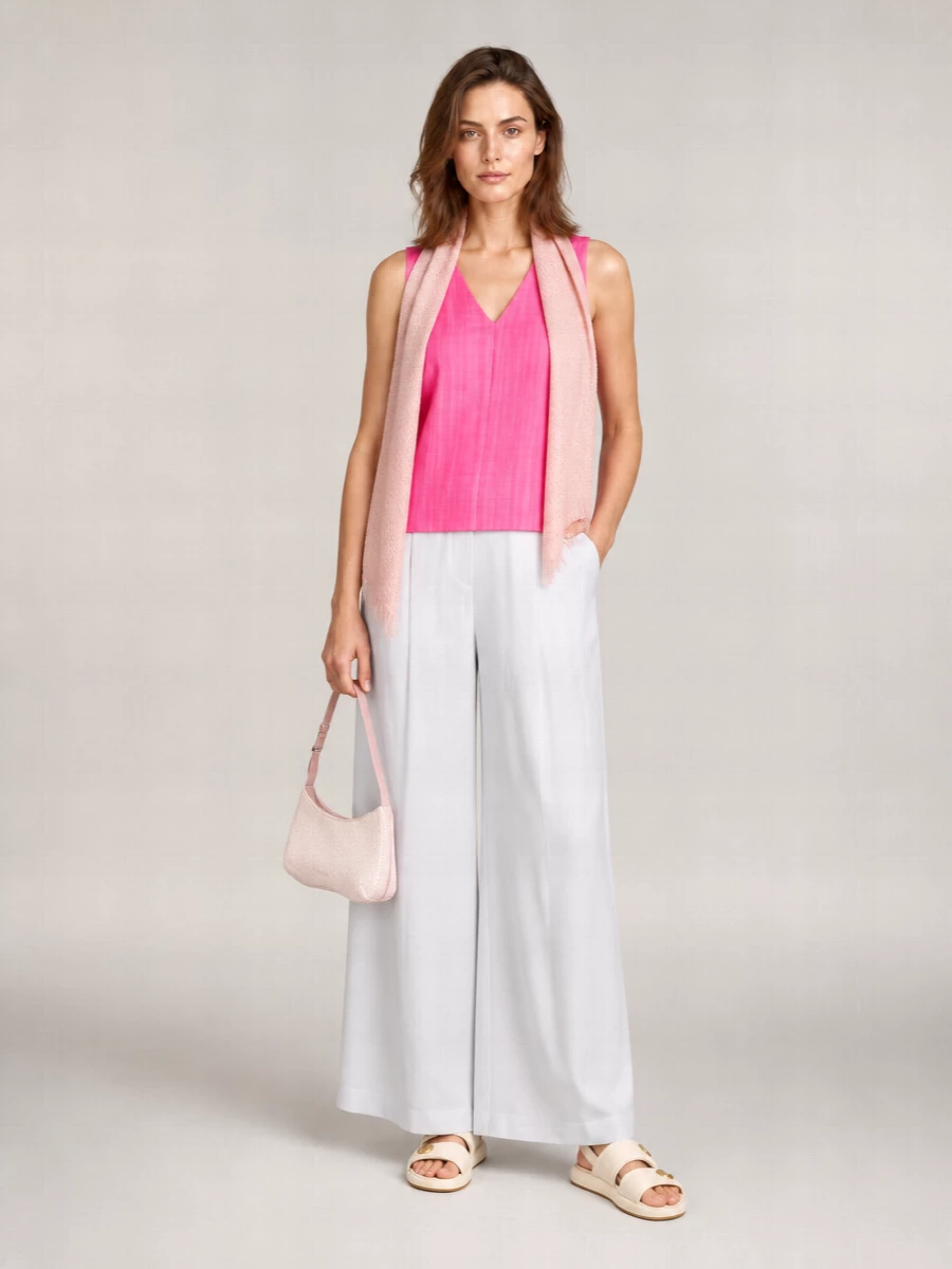 A vivid pink V-neck top is softened with weightless white wide-leg trousers, creating a fresh column of color and light for warm days. Cream slingback flats and a blush baguette keep the palette gentle and polished, while a whispery pink scarf ties the romantic tones together. The result is relaxed, feminine and quietly refined from brunch to late-afternoon drinks.