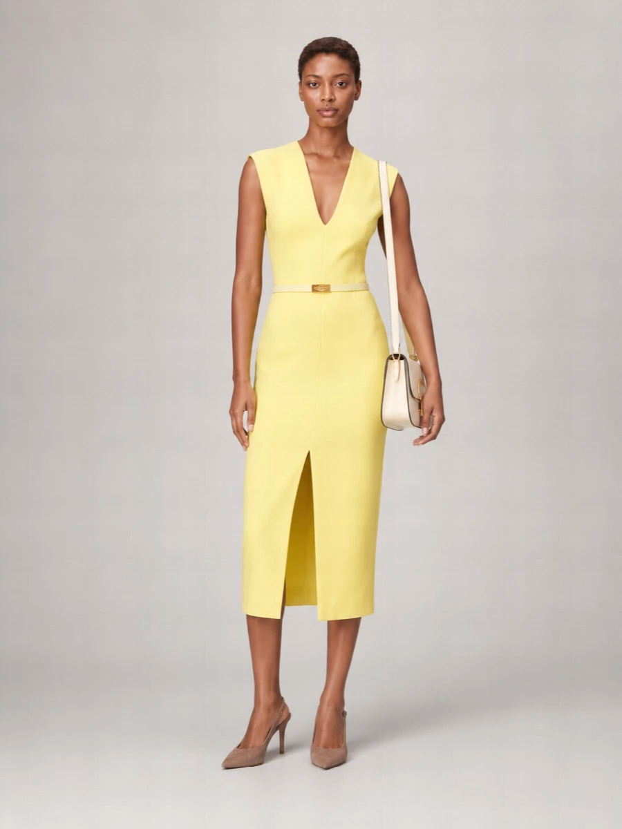 I’m anchoring this with the dress route, because the lemon Givenchy sheath and Bottega belt together feel like a precise, tonal color study rather than a more expected trouser-and-blouse set. The fitted midi keeps the silhouette razor-clean, while taupe stilettos and a cream flap bag soften the yellow and keep the whole composition quietly expensive instead of loud. It is a modern cocktail ensemble with a whisper of y2k via color, held firmly in a quiet-luxury, architectural mood.