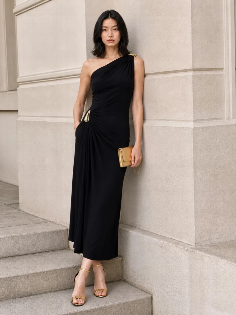 This is a pure evening column built around liquid black and precise flashes of gold, letting the Tom Ford sandals do the talking. The one-shoulder drape and sculptural hardware feel romantic yet controlled, while the slim silhouette keeps the mood sleek rather than fussy. I chose the dress route over separates to keep the line uninterrupted and give the metallics a clean, gallery-like backdrop to shine against.