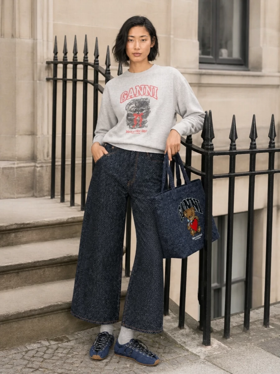 Ganni graphic sweatshirt wide leg jeans outfit
