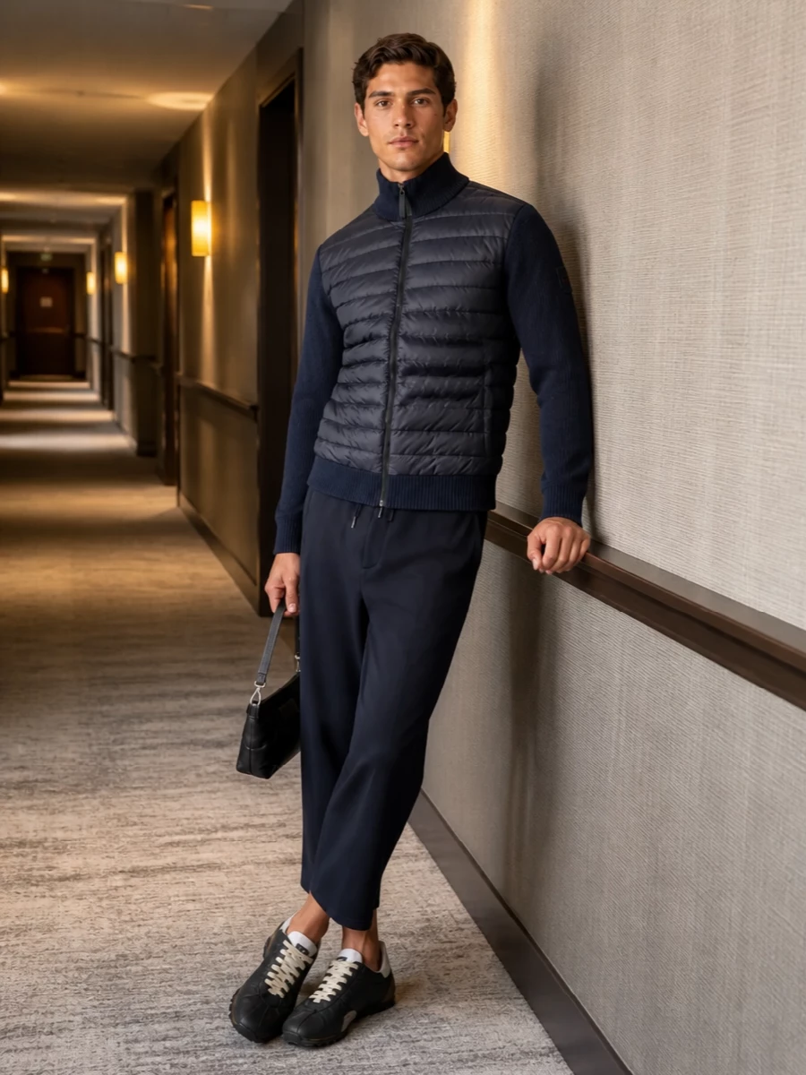 Navy technical knit meets cropped Sacai trouser for a calm, city-ready take on sport utility. Margiela runners and a padded mini shoulder bag keep the palette muted and the details quietly precise. The result feels relaxed yet intentional, ideal for commutes, gallery days and low-key dinners alike.