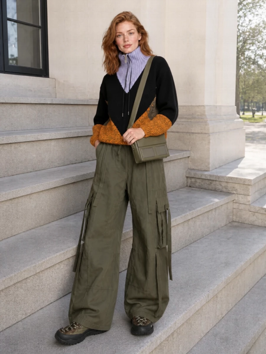 This is a sport-utility uniform built around a deep khaki story, with the Marni chevron zip-up flowing straight into exaggerated Dolce&Gabbana cargo volume and the chunky Miu Miu trek sneaker. Olive and black tones stay tight and graphic, so the Margiela crossbody can sit in the same colour family without breaking the line, keeping everything city-ready but clearly inspired by hike and ski gear. I chose the top-and-bottom route over a dress so the sneakers can sit in their natural habitat, playing with proportion and pockets rather than competing with a single statement column.