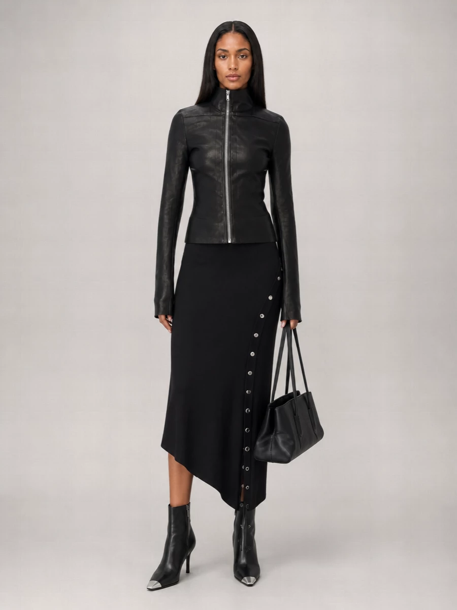 I kept this around a single, elongated black column so the Rick Owens jacket reads as pure armor over it. The Attico asymmetric dress, metal-capped Wang boots and structured shoulder bag all speak in the same sharp, hardware-driven vocabulary, giving you a tailored, street-leaning night ensemble with real precision. Separates with the jacket risk feeling busy in leather-on-leather, while this route keeps the impact clean and controlled.