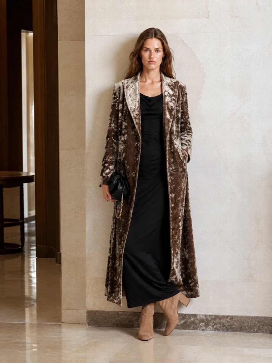 I’m taking the dress route here so the Uma Wang coat can play leading role over a single, fluid column rather than battling extra tailoring. The Vivienne Westwood maxi brings romantic structure against the velvet, while camel suede heels and a sculpted black clutch keep the palette deep, warm and nocturnal without feeling heavy. It is city-evening glamour that reads plush and considered rather than over-styled.