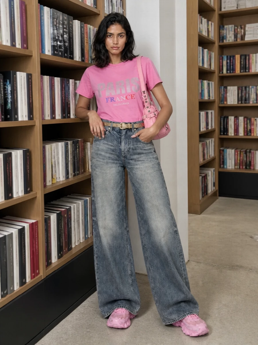 Balenciaga pink paris tee wide leg jeans outfit