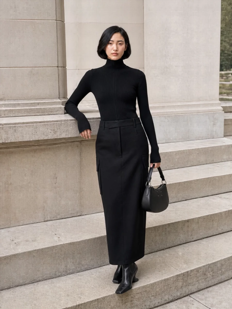 A strict Rick column on the bottom meets a second‑skin high‑neck knit on top for a long, disciplined silhouette in pure black. Sculptural wedge boots and a compact crescent bag keep everything sharp but mobile, while the optional scarf lets you play with volume around the face without breaking the monochrome tension.