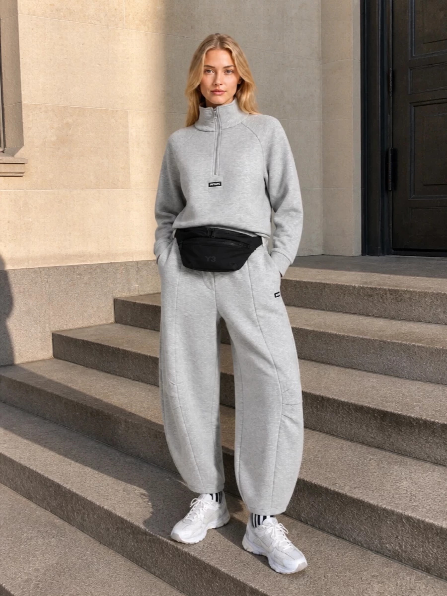 Rotate grey track pants nike sneakers outfit