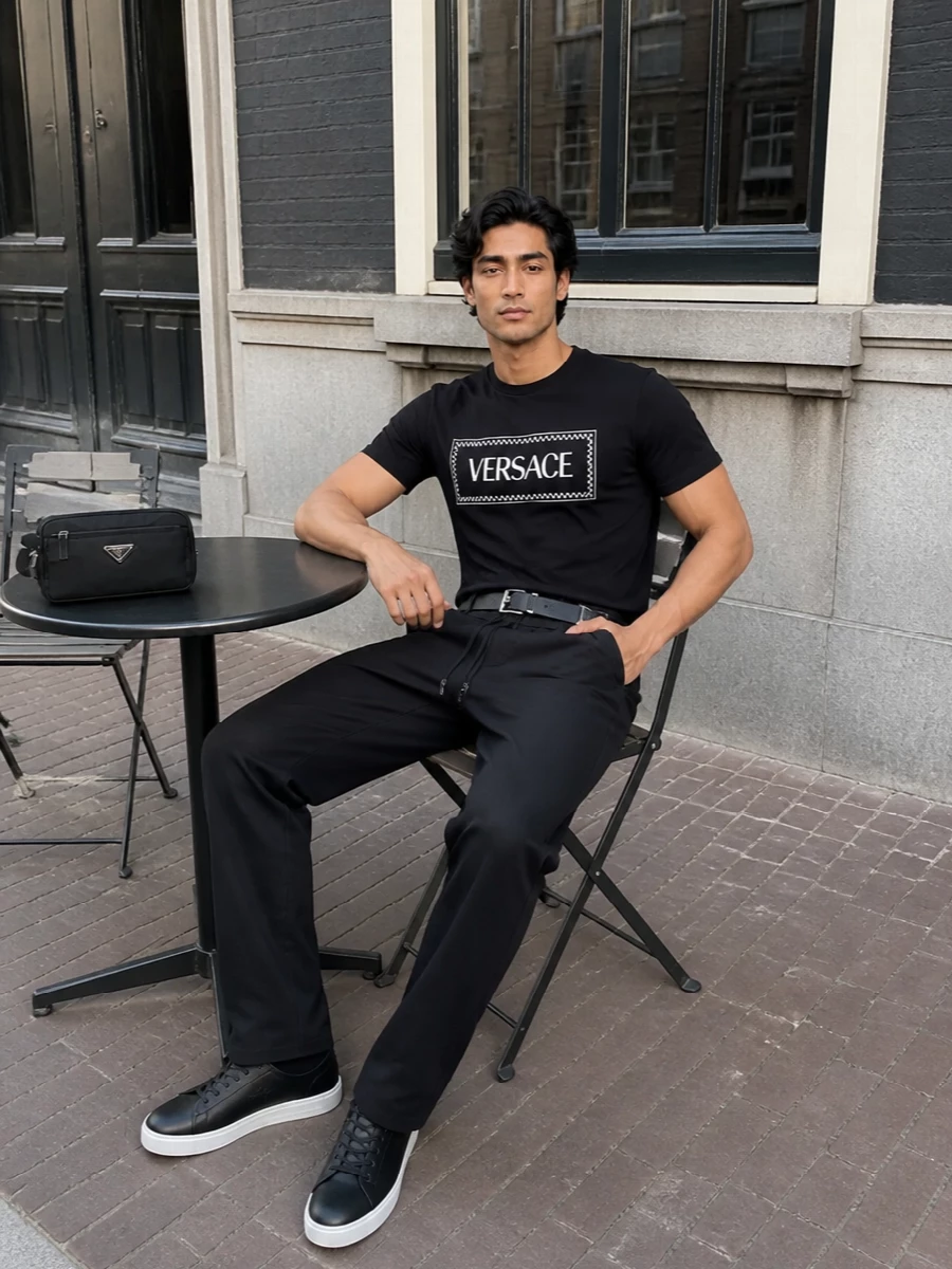 Versace black logo tee drawstring pants outfit
