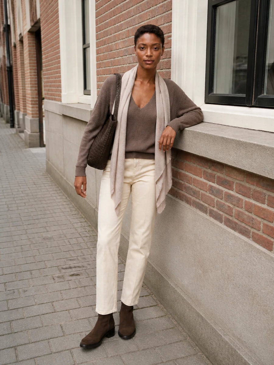The row taupe sweater cream jeans brown bag