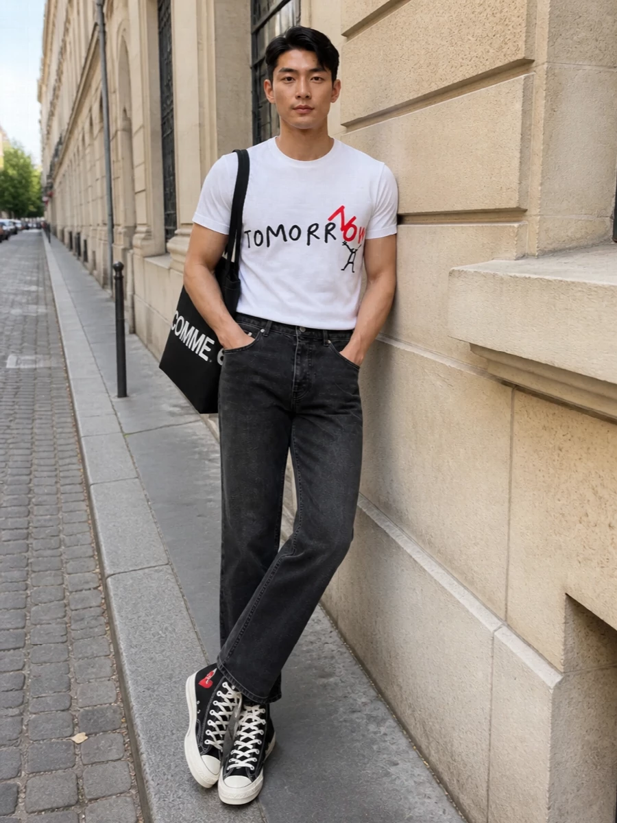 The Comme des Garçons tee sits on washed black high-rise denim for a clean, slightly grunge line that keeps the graphic front and center. Black CDG high-tops and a bold logo tote echo the tee’s red and black story, tightening the palette into a sharp, art-school streetwear uniform. Subtle branded socks finish it off without distracting from the core graphic conversation.