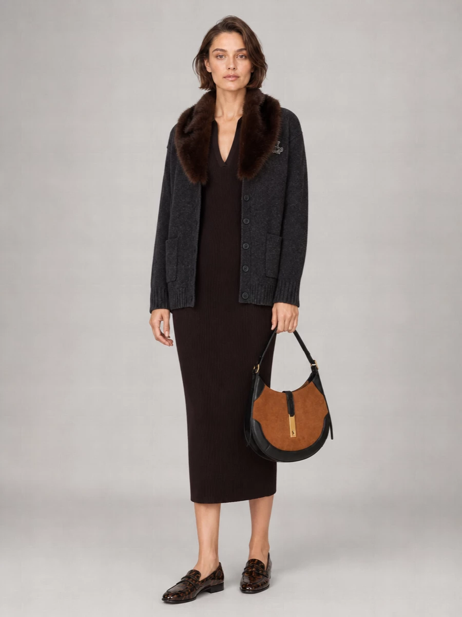 I am building this around the dress path, because the cardigan’s faux-fur shawl collar is already a statement and reads chicest over a single, long column rather than knit-on-knit separates. The chocolate ribbed midi dress, espresso loafers and tan‑black crescent bag create a coherent story of rich browns and charcoals with a quiet equestrian twist, perfect for city days that run into dinner. Tailored details in the dress and accessories balance the cardigan’s softness, so the result feels polished but still deeply comfortable for winter.