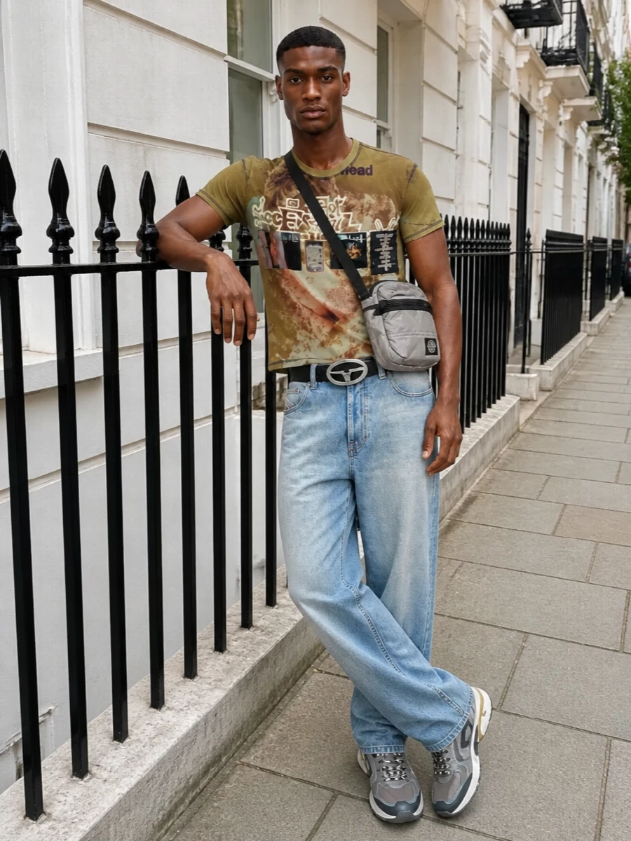 Graphic, zine-style Diesel jersey meets loose faded denim for a slouchy Y2K street mood that feels lived in, not costume. Technical runners keep it fast and grounded, while a compact crossbody and bold belt hardware tighten the details so the print can do the talking.