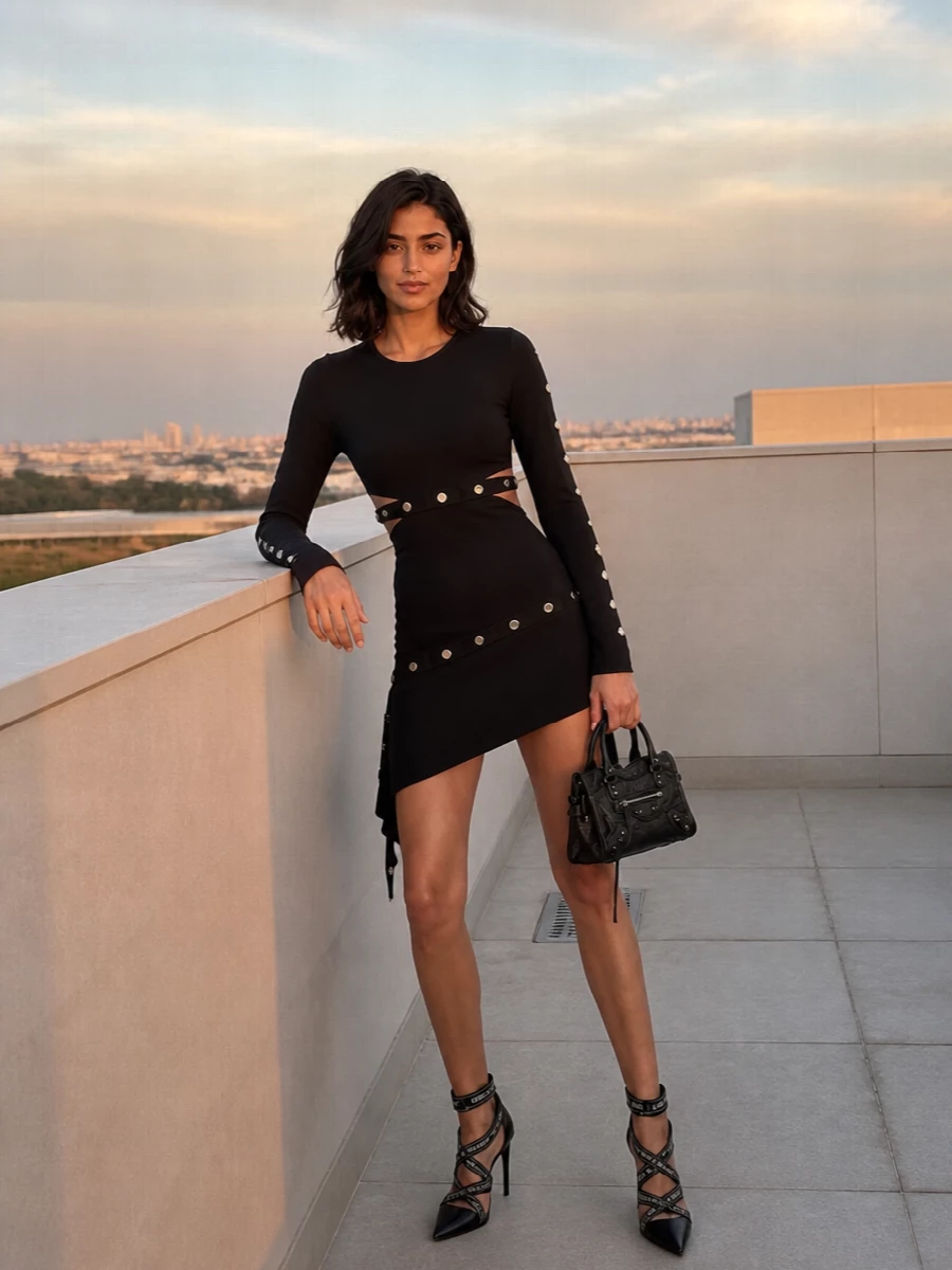 This is a hard-edged, club-ready pairing that pushes the Balenciaga mini into full nocturnal mode. The Attico’s cut-out, eyelet-slashed dress and Balmain’s logo cage stilettos sync on black, silver and y2k attitude, keeping everything tight, leggy and unapologetically graphic. Opting for the single dress anchor instead of separates keeps the silhouette clean and high-impact, letting the bag’s texture and hardware read as part of the same urban armor story.
