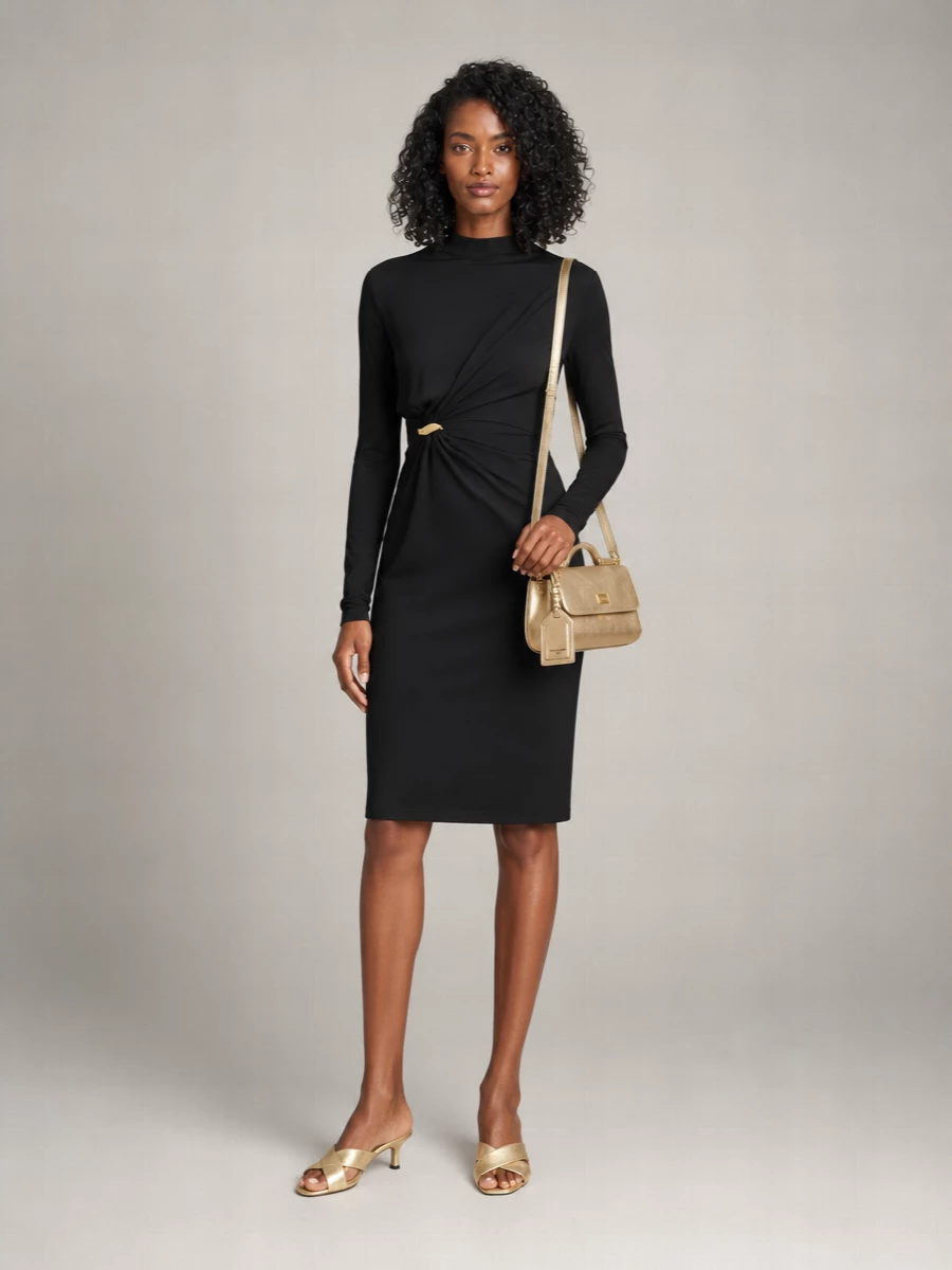 A single, sculpted black Bottega Veneta dress in quiet drapery makes the perfect backdrop for the Dolce&Gabbana metallic gold mini bag, creating a romantic yet razor-clean evening mood. Gold Bottega mules pick up the bag’s shine without overwhelming the silhouette, keeping the focus on fluid lines and warm metal accents. Choosing the dress route rather than separates keeps the outfit statuesque and cohesive, letting the accessories do the talking while the cut does the flirting.