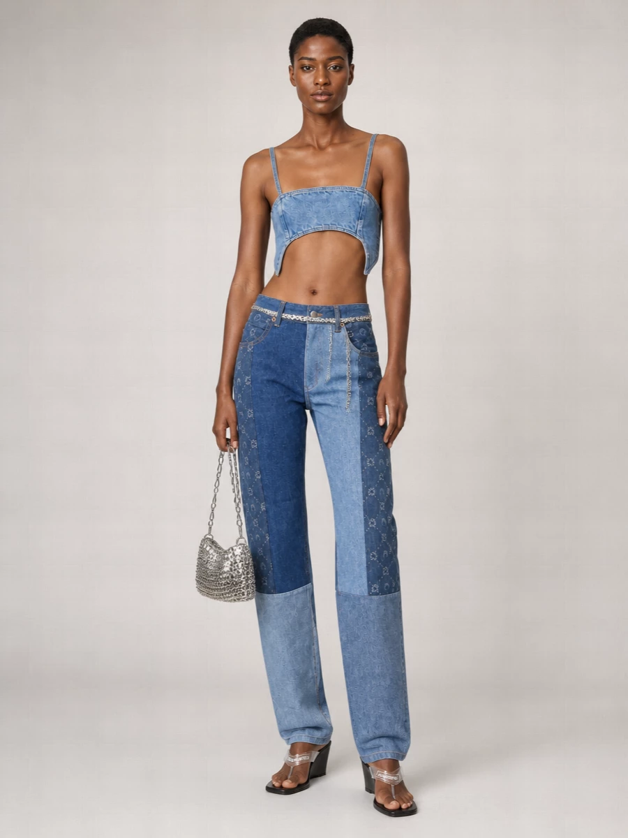 Marine Serre’s sculpted denim bralette meets her tonal high-rise patchwork jeans for a confident take on all-blue, body-framing streetwear. Coperni’s black wedge thong keeps it firmly in a y2k, going-out lane, while a silver chainmail baguette and matching chain belt pull the metal detailing into one deliberate, club-ready statement. The result is sleek, branded and graphic without losing ease of movement.