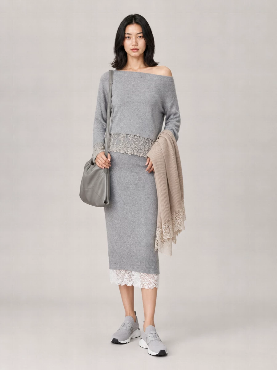 A monochrome knit set in heather grey and lace creates a soft, romantic column that feels dressed but still relaxed. Tonal technical sneakers keep it quietly casual, while the steel-grey shoulder bag and lace-trim wrap add just enough polish for city days that drift into dinner. The result is an easy, cocooned outfit that reads luxurious without trying.