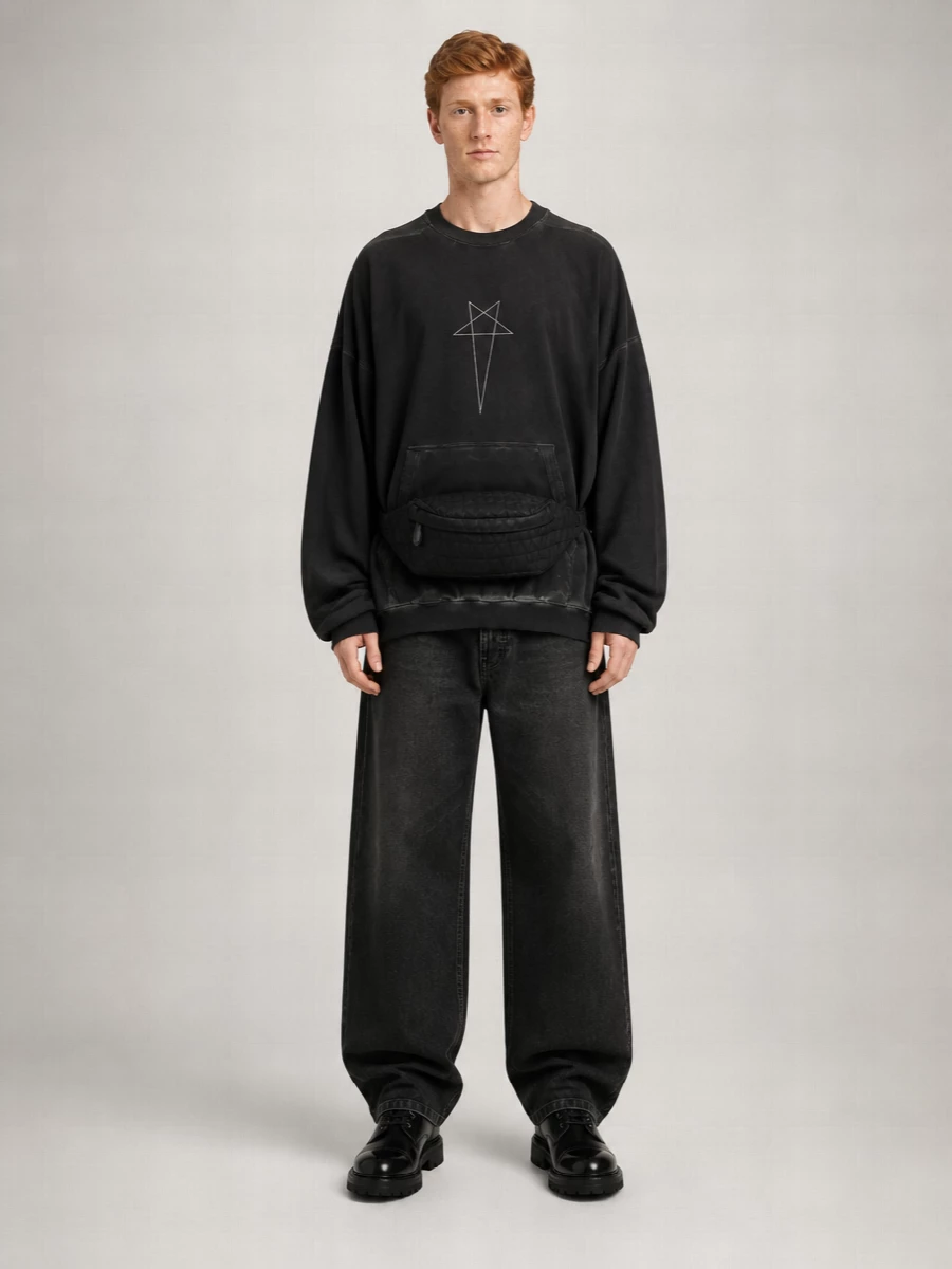 Monochrome Rick-style volume meets quiet-luxury combat boots for a dark, utilitarian city uniform. The oversized washed-black top and rigid wide-leg denim pool cleanly over the chunky lace-ups, giving a strong, grounded line. A low-profile belt bag keeps the energy street and practical without interrupting the silhouette.