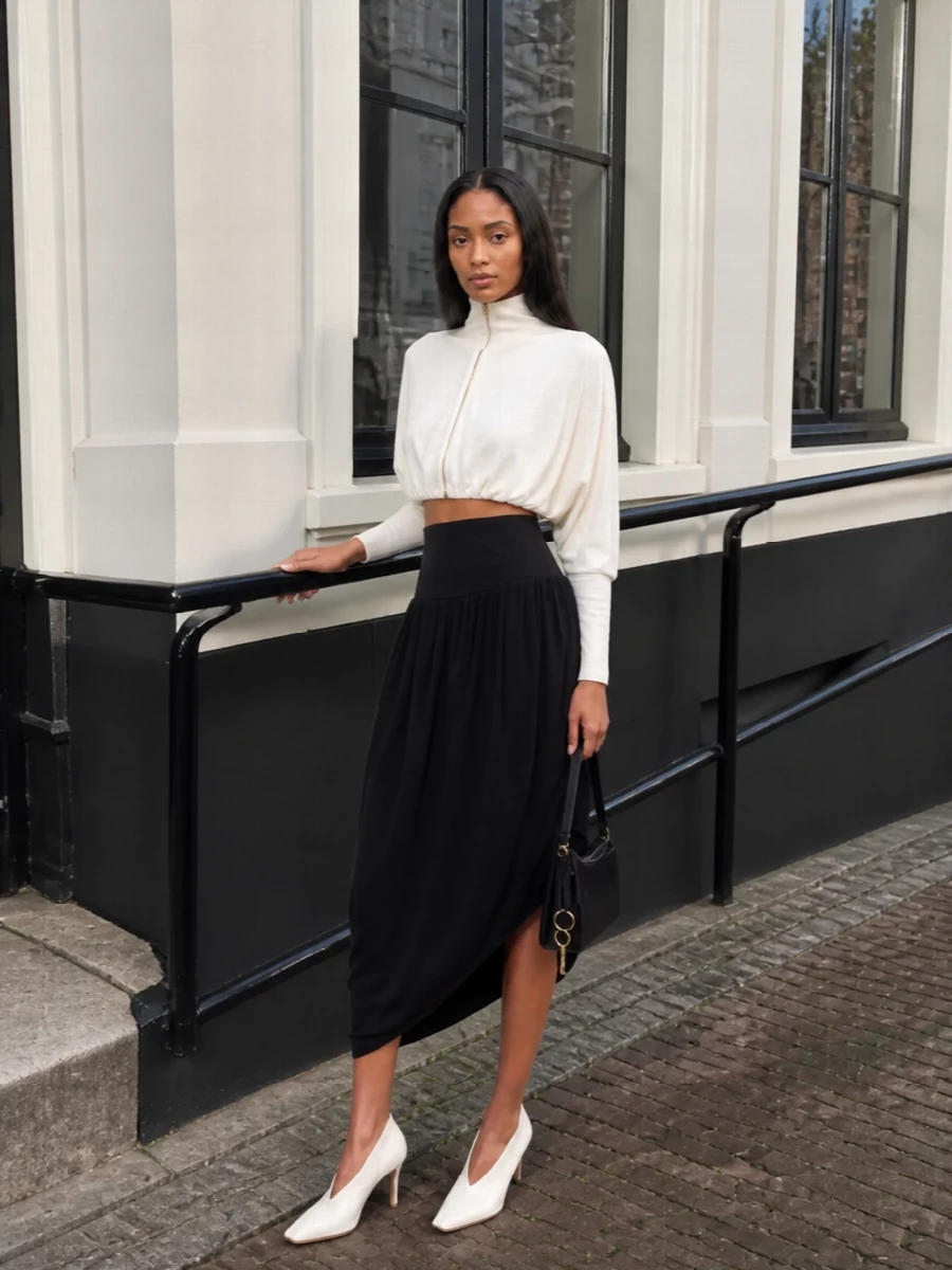 Alaia ivory top black asymmetric midi skirt
