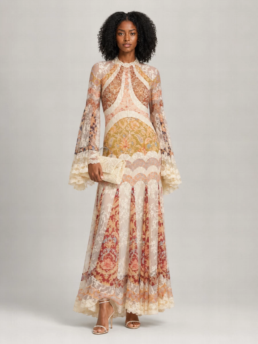 A sheer Zimmermann gown in cream and terracotta rose meets champagne crystal stilettos for a romantic, candlelit occasion ensemble. A buttercream lace clutch and pearled lariat keep the mood antique and soft, adding just enough sparkle to complement rather than compete with the dress.