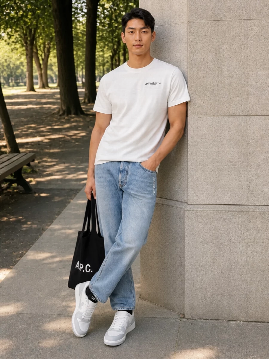 Off white tee light wash jeans sneakers outfit