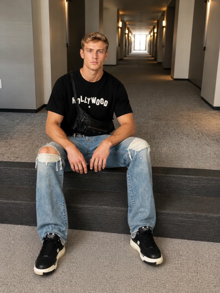 Amiri distressed jeans black hollywood tee outfit