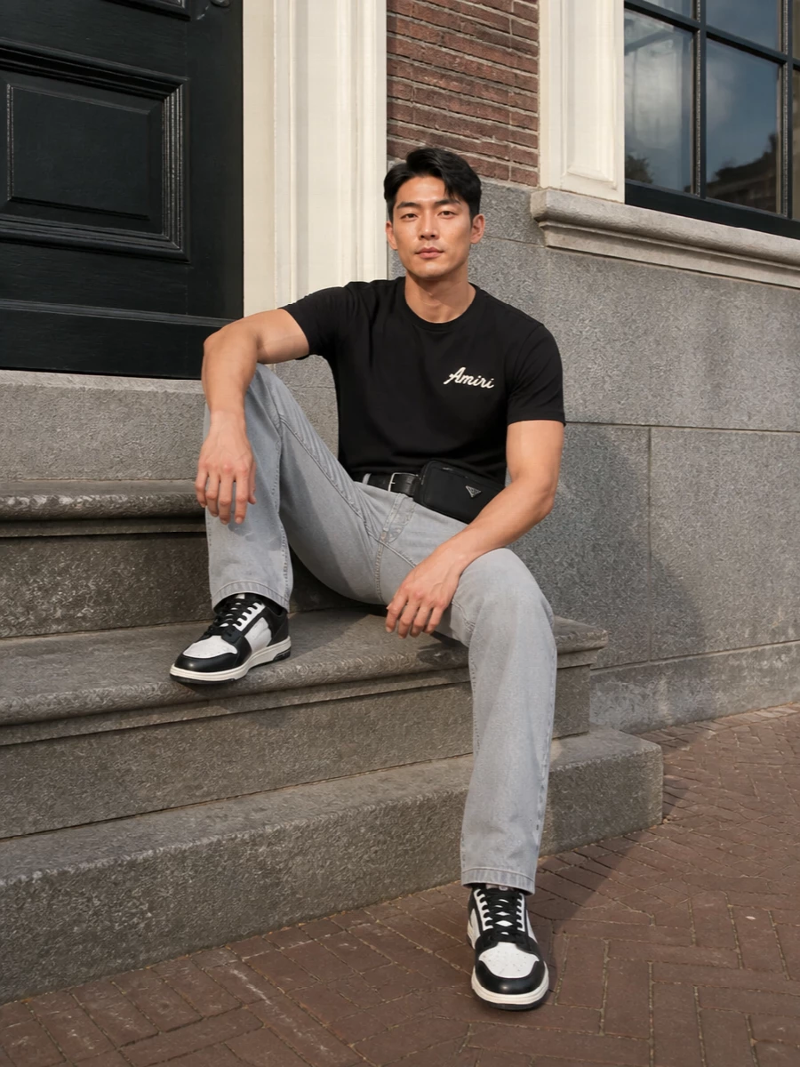 Amiri black tee light grey jeans outfit