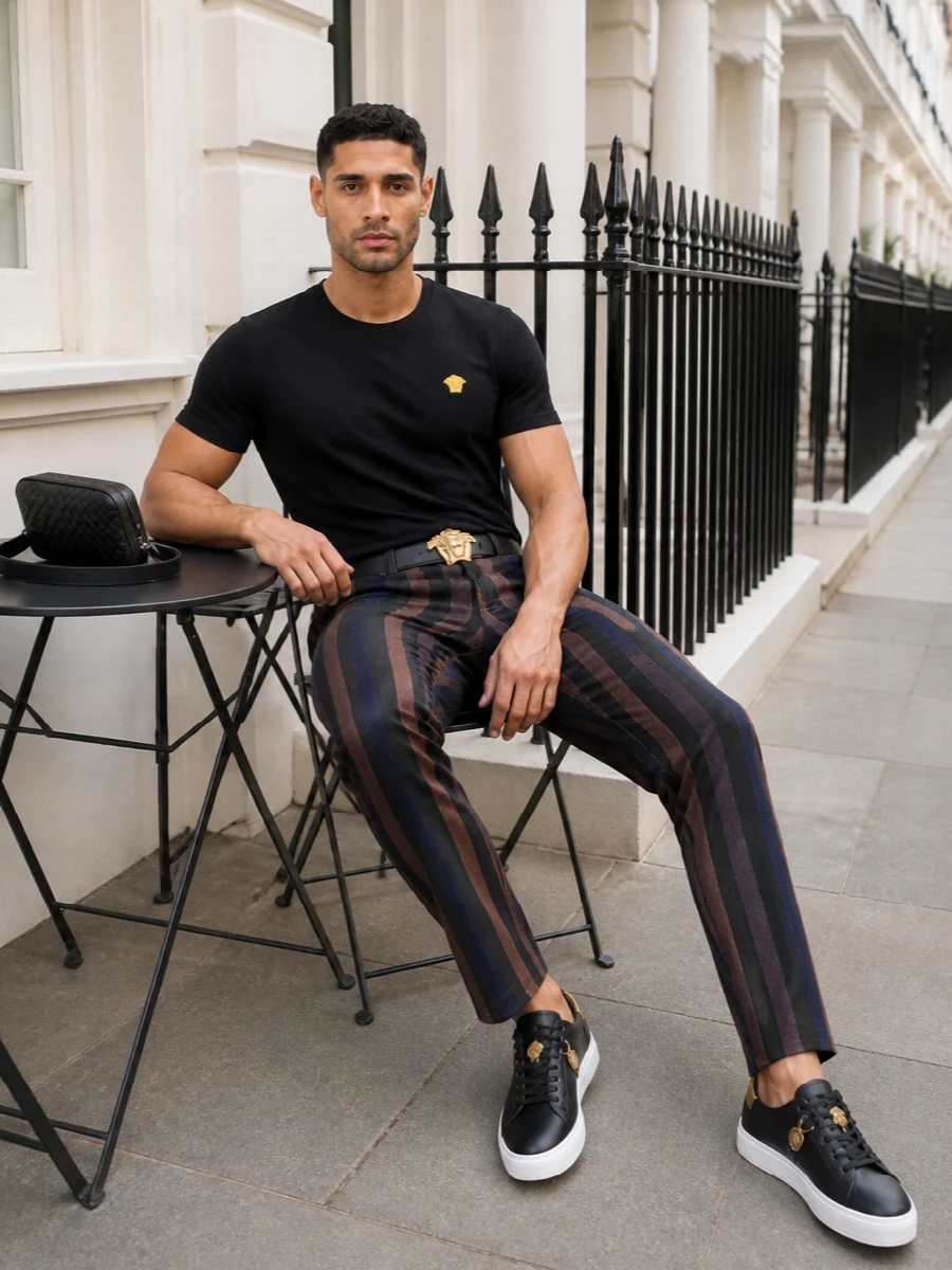 Versace striped jeans black tee sneakers outfit